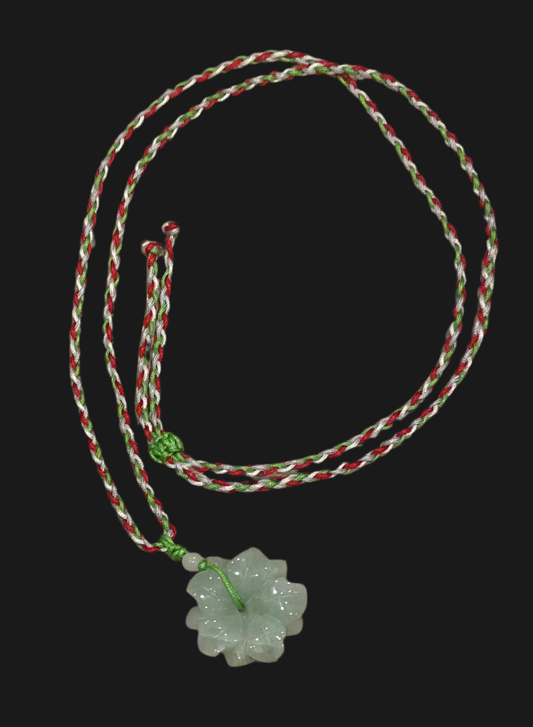 Handmade necklace with colourful string and green jade pendant