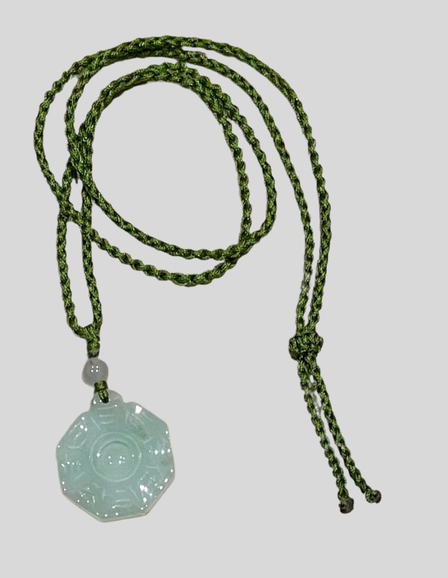 Handmade necklace with a green jade pendant