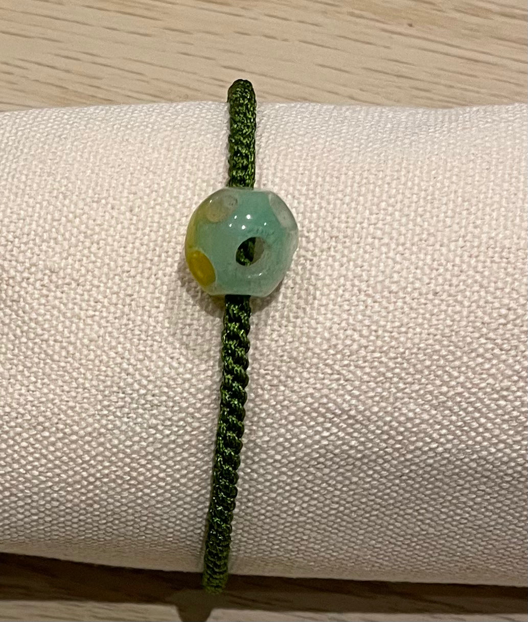 Handmade bracelet with a green jade charm