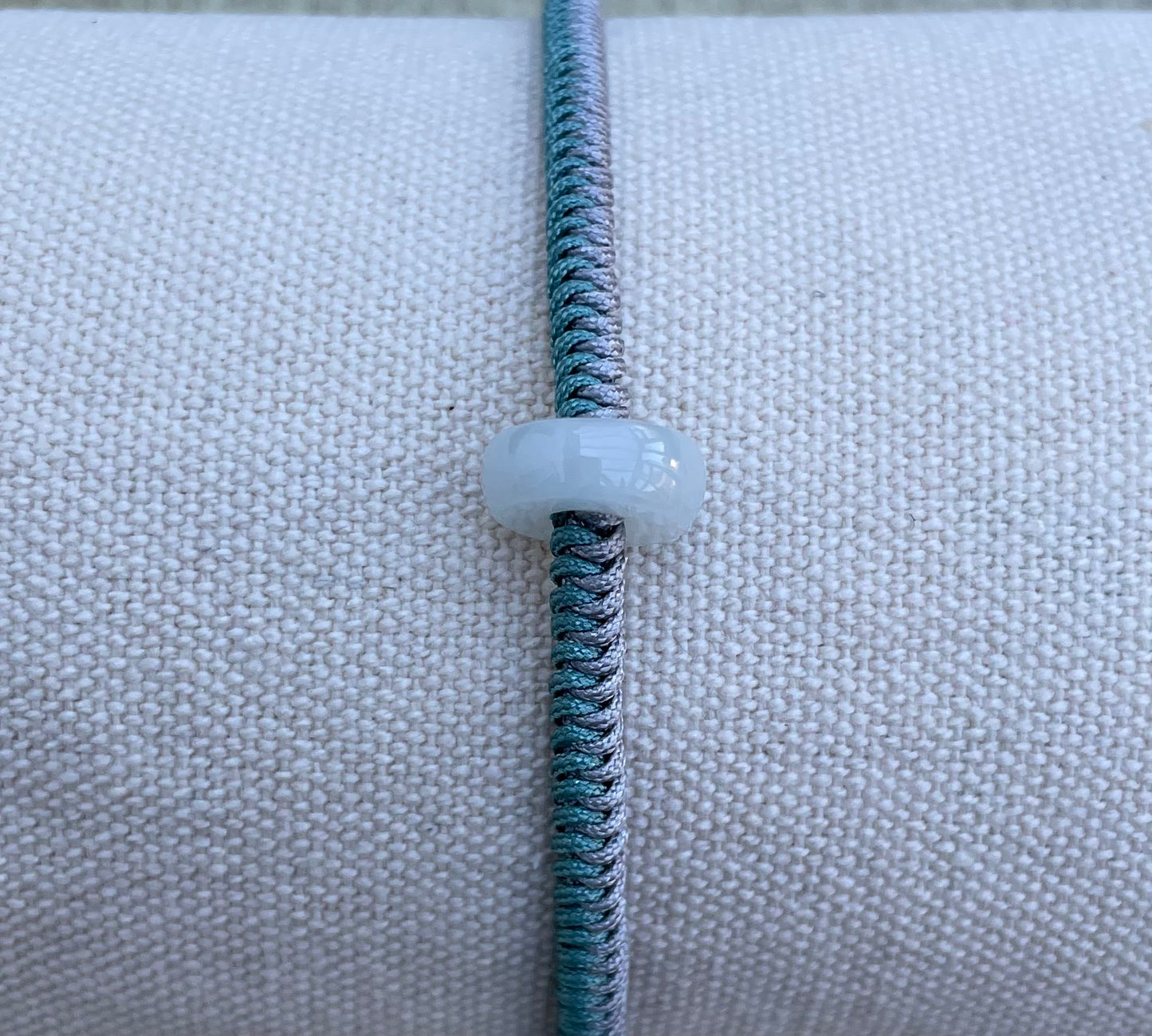 Handmade bracelet with a white jade charm