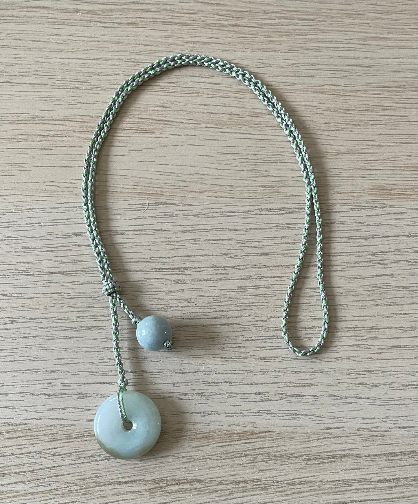 Handmade necklace with green jade donut and bead pendants
