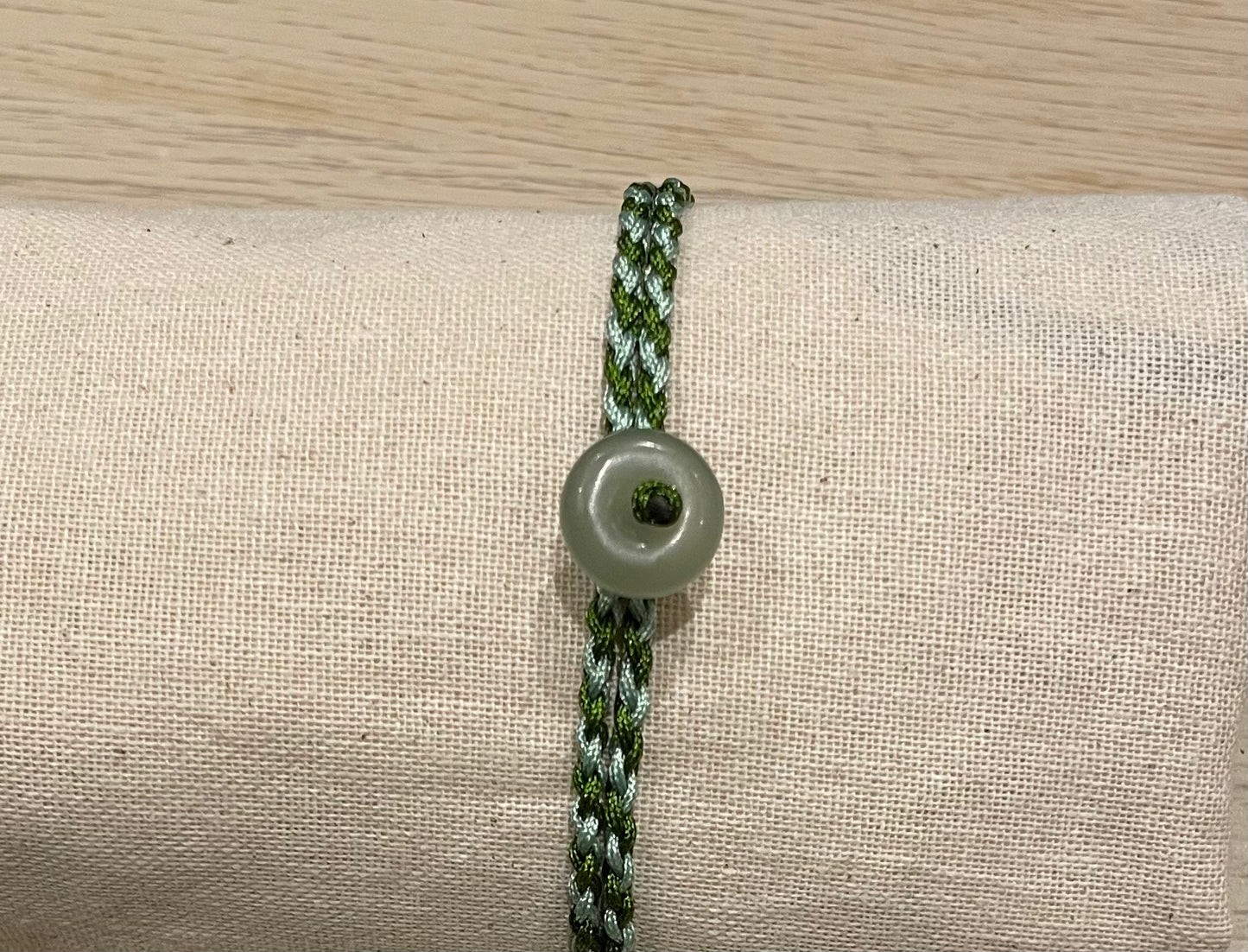 Handmade bracelet with a small Hetian jade donut