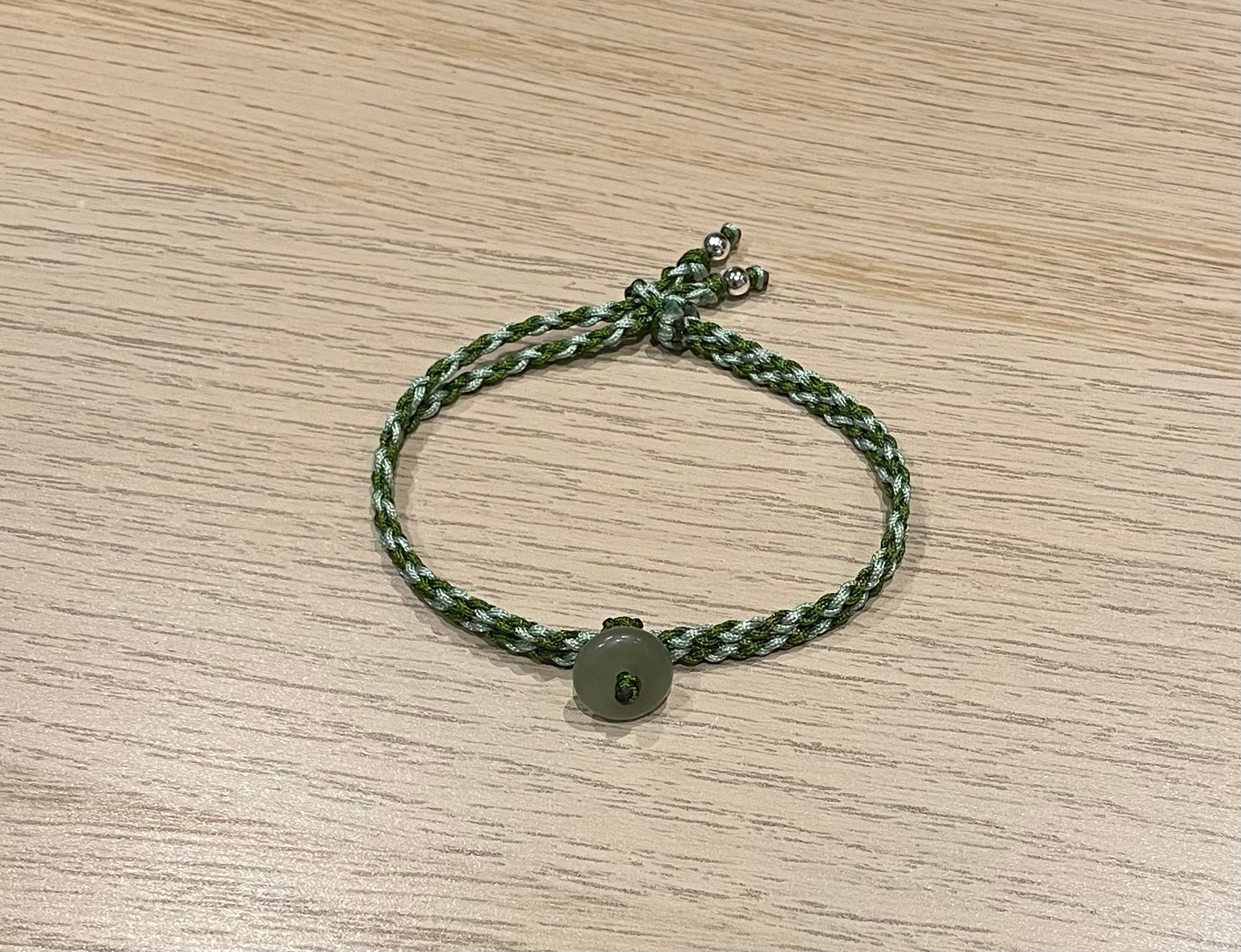 Handmade bracelet with a small Hetian jade donut
