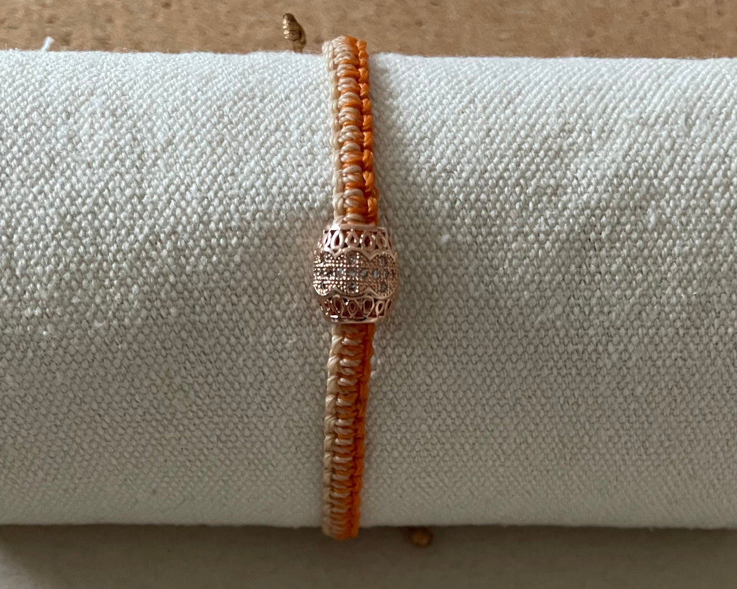 Handmade bracelet with an alloy charm and waxed string