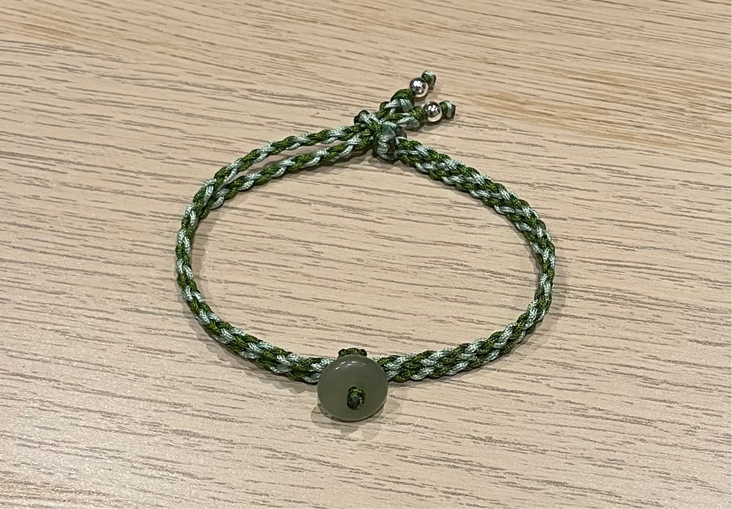 Handmade bracelet with a small Hetian jade donut