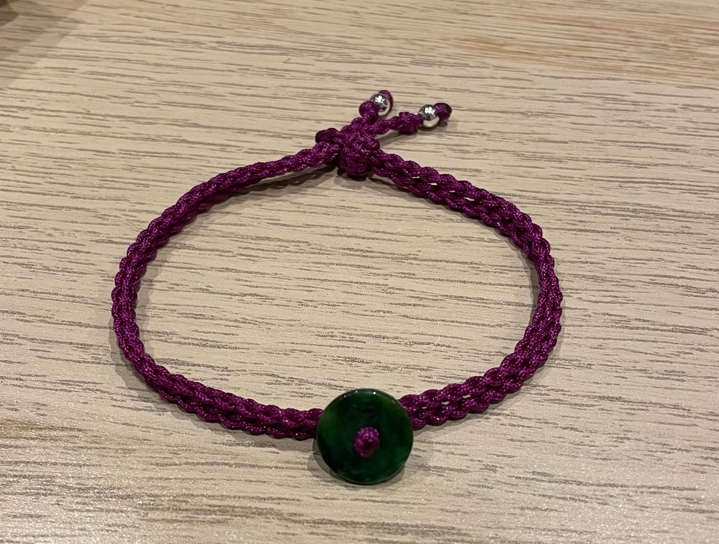 Handmade bracelet with a green jade charm
