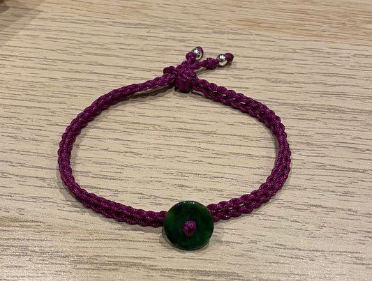 Handmade bracelet with a green jade charm