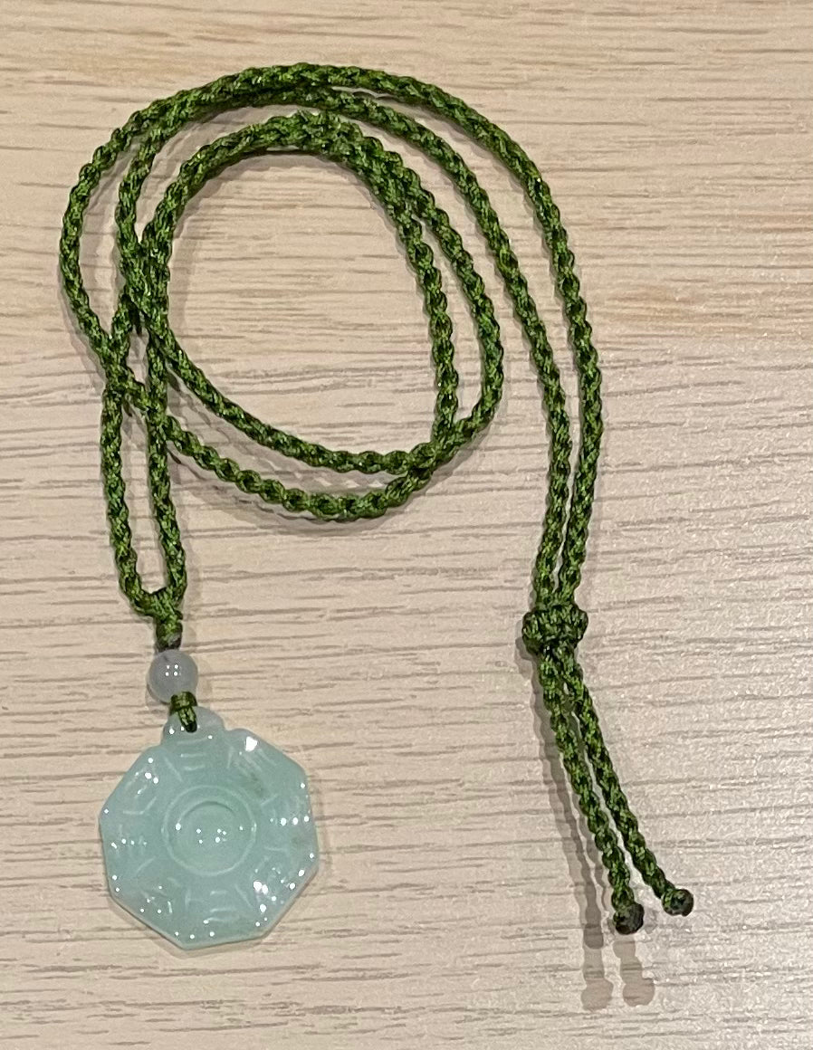 Handmade necklace with a green jade pendant