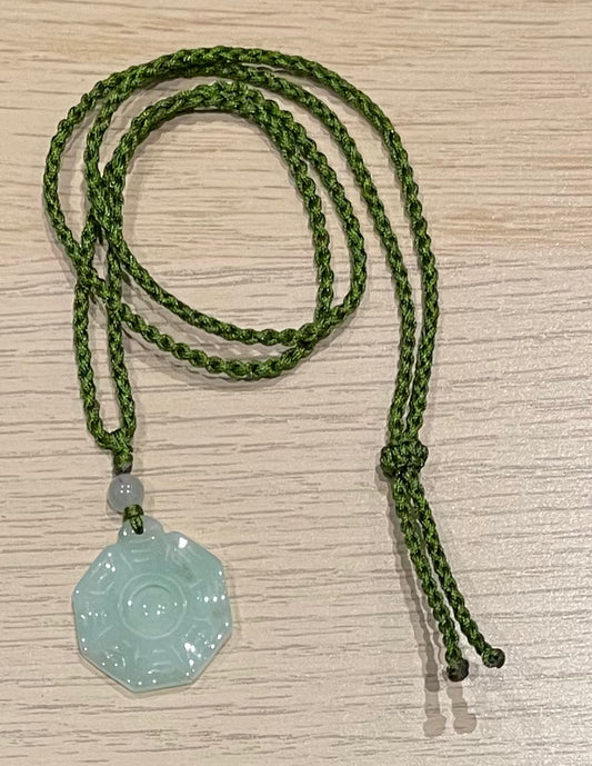 Handmade necklace with a green jade pendant