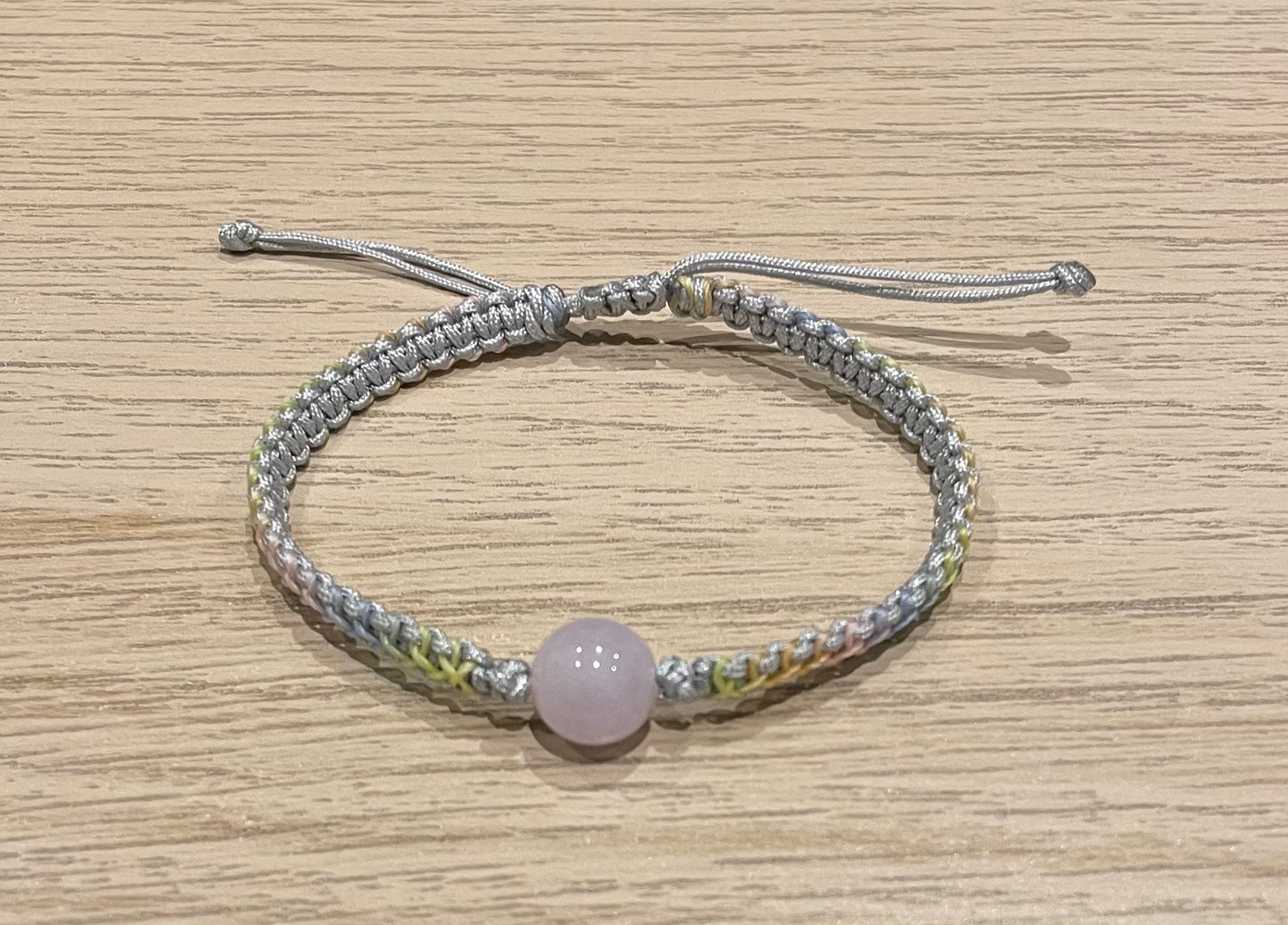 Handmade bracelet with a purple bead charm