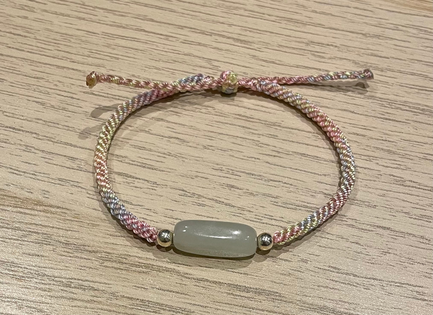 Handmade bracelet with a Hetian jade charm