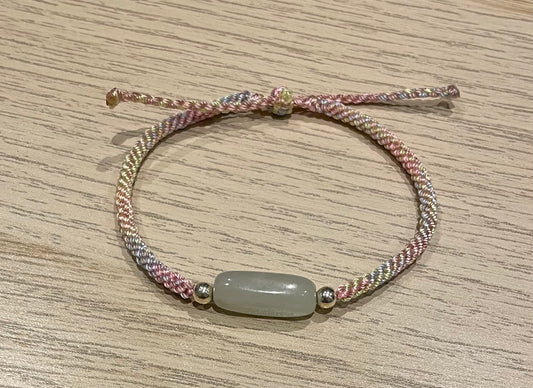 Handmade bracelet with a Hetian jade charm
