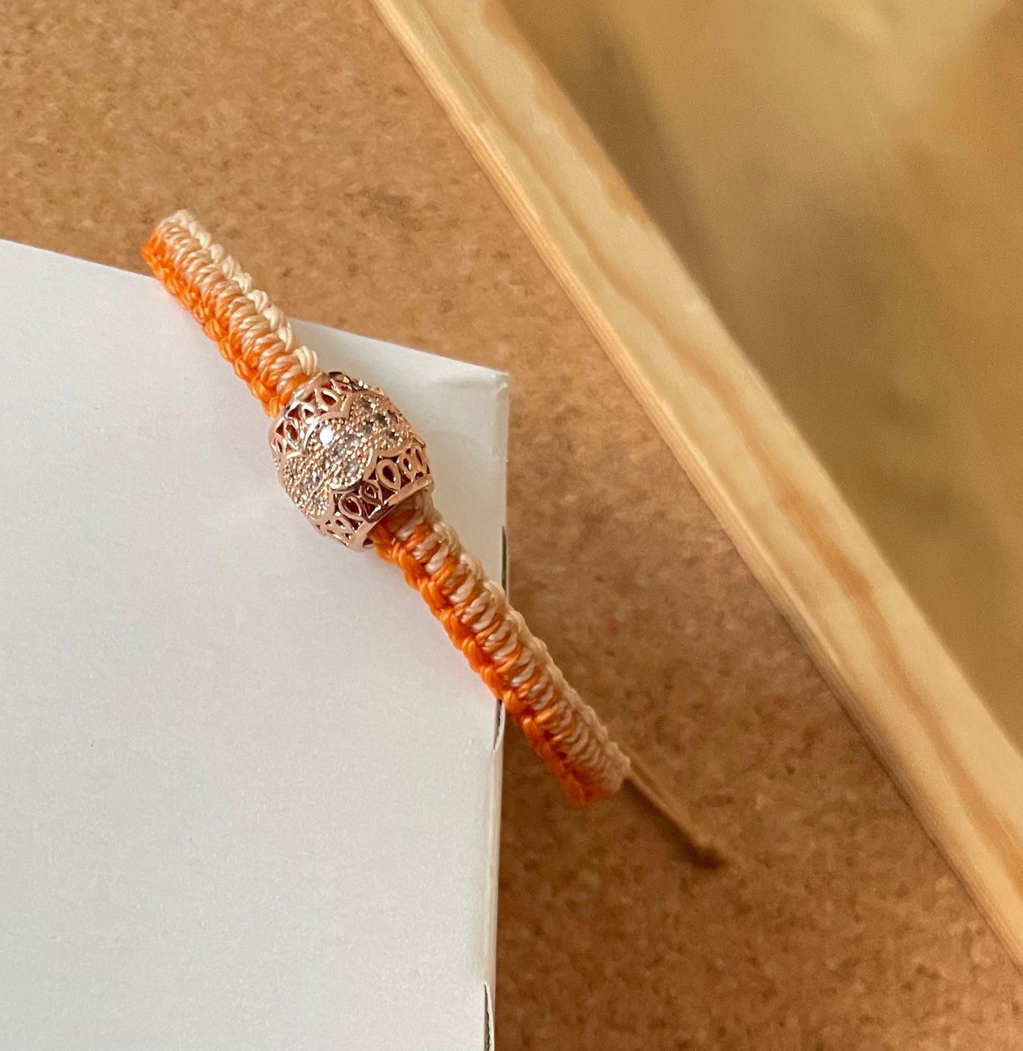 Handmade bracelet with an alloy charm and waxed string