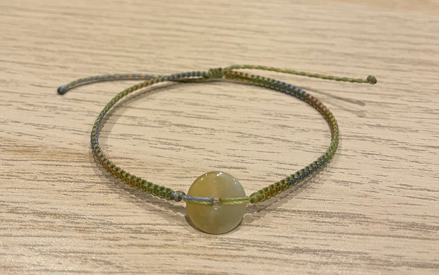 Handmade bracelet with a 12mm yellow jade donut