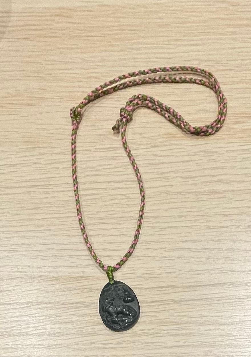 Handmade necklace with a dark green jade tiger pendant