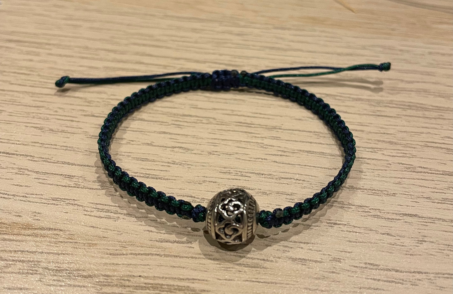 Handmade bracelet with a silver alloy bead charm