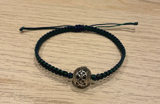 Handmade bracelet with a silver alloy bead charm