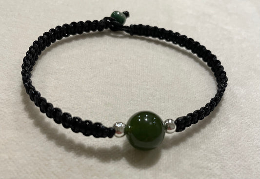 Handmade bracelet with a green jade bead charm