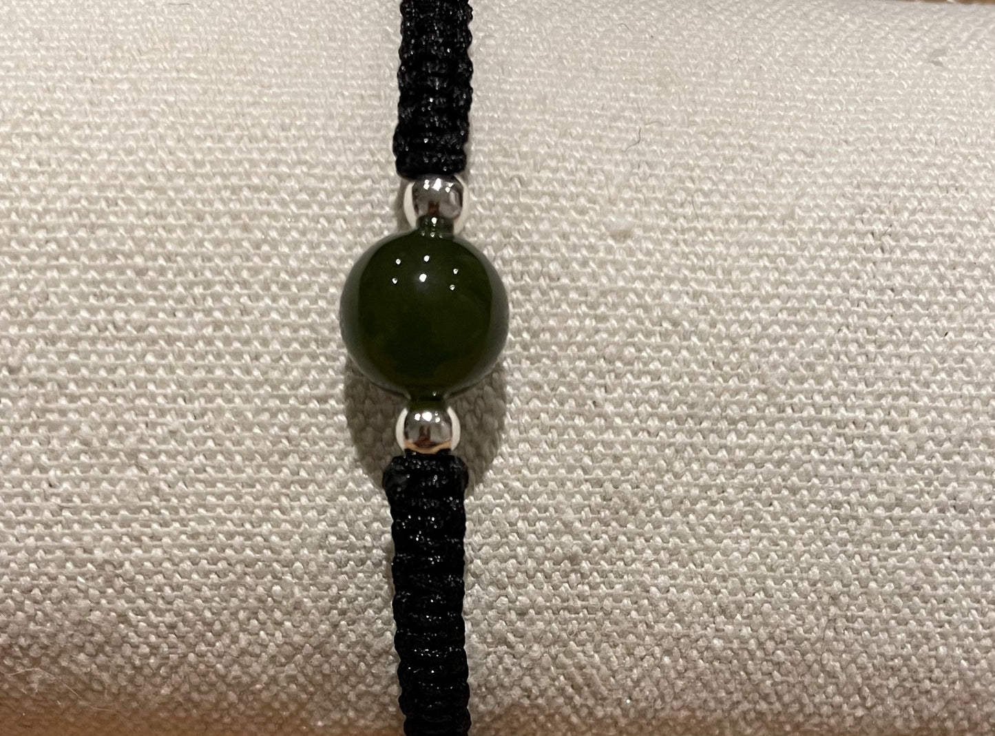 Handmade bracelet with a green jade bead charm