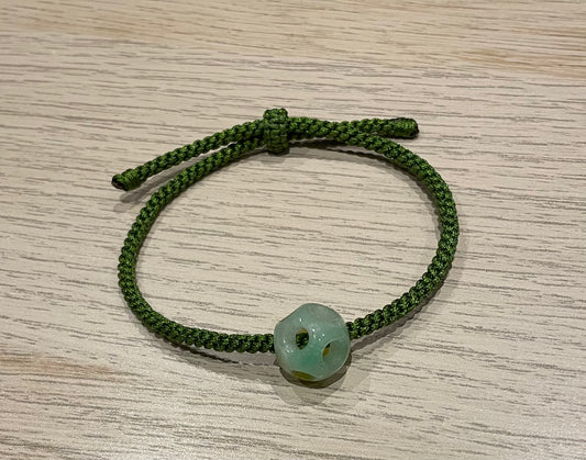 Handmade bracelet with a green jade charm