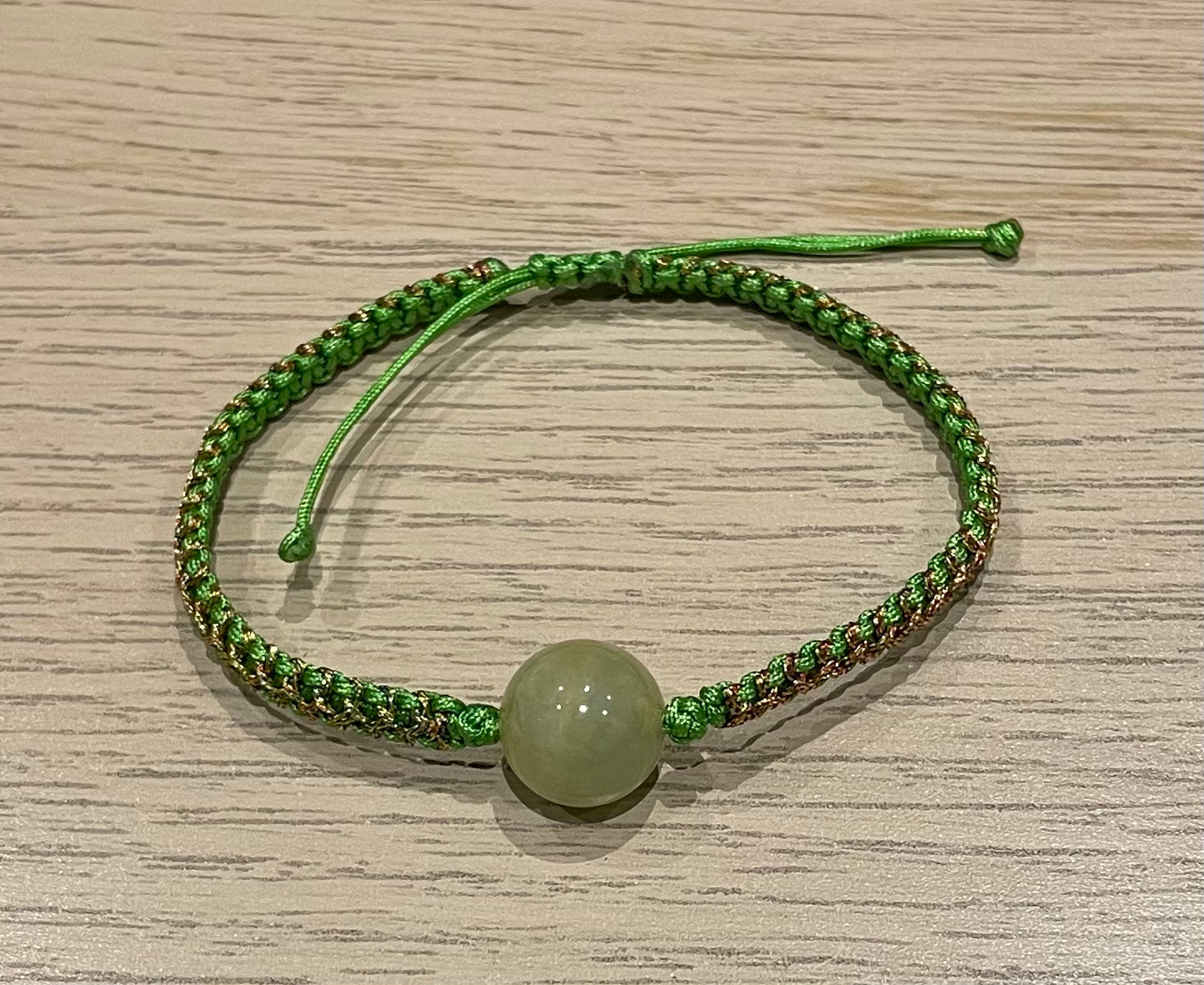 Handmade bracelet with a green jade bead