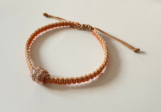 Handmade bracelet with an alloy charm and waxed string