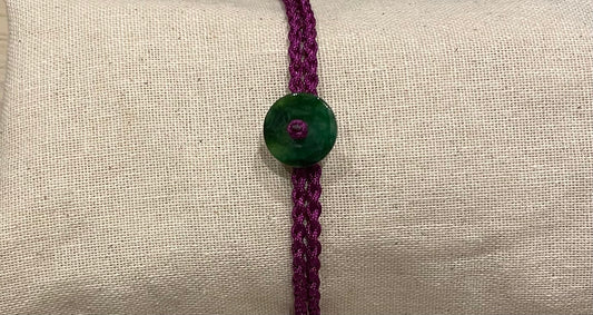 Handmade bracelet with a green jade charm