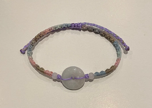 Handmade bracelet with light purple jade donut and gradient colour waxed string