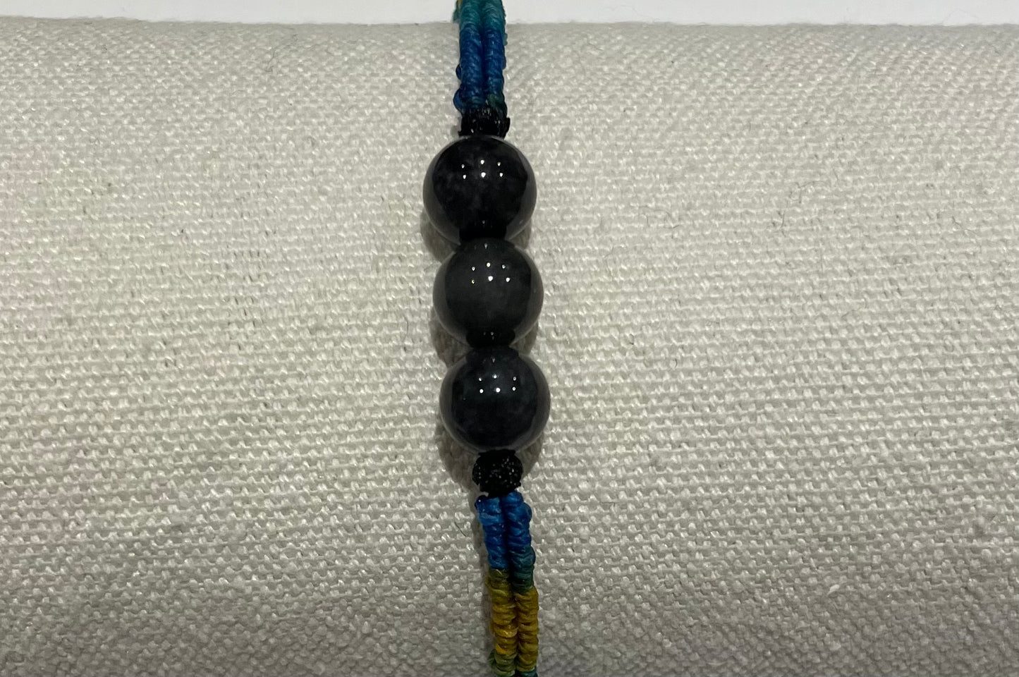 Handmade bracelet with black jade beads and gradient colour waxed string