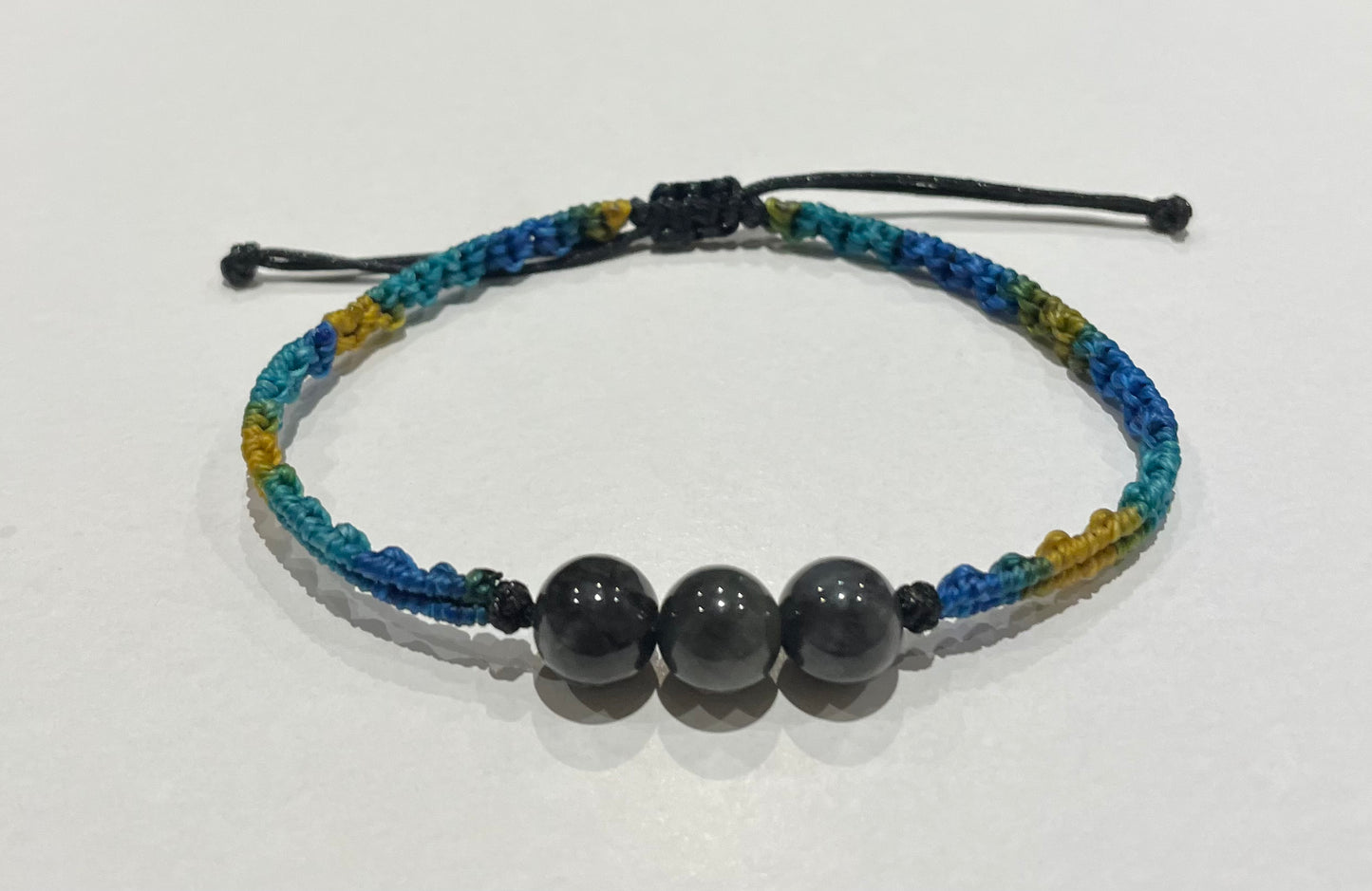 Handmade bracelet with black jade beads and gradient colour waxed string