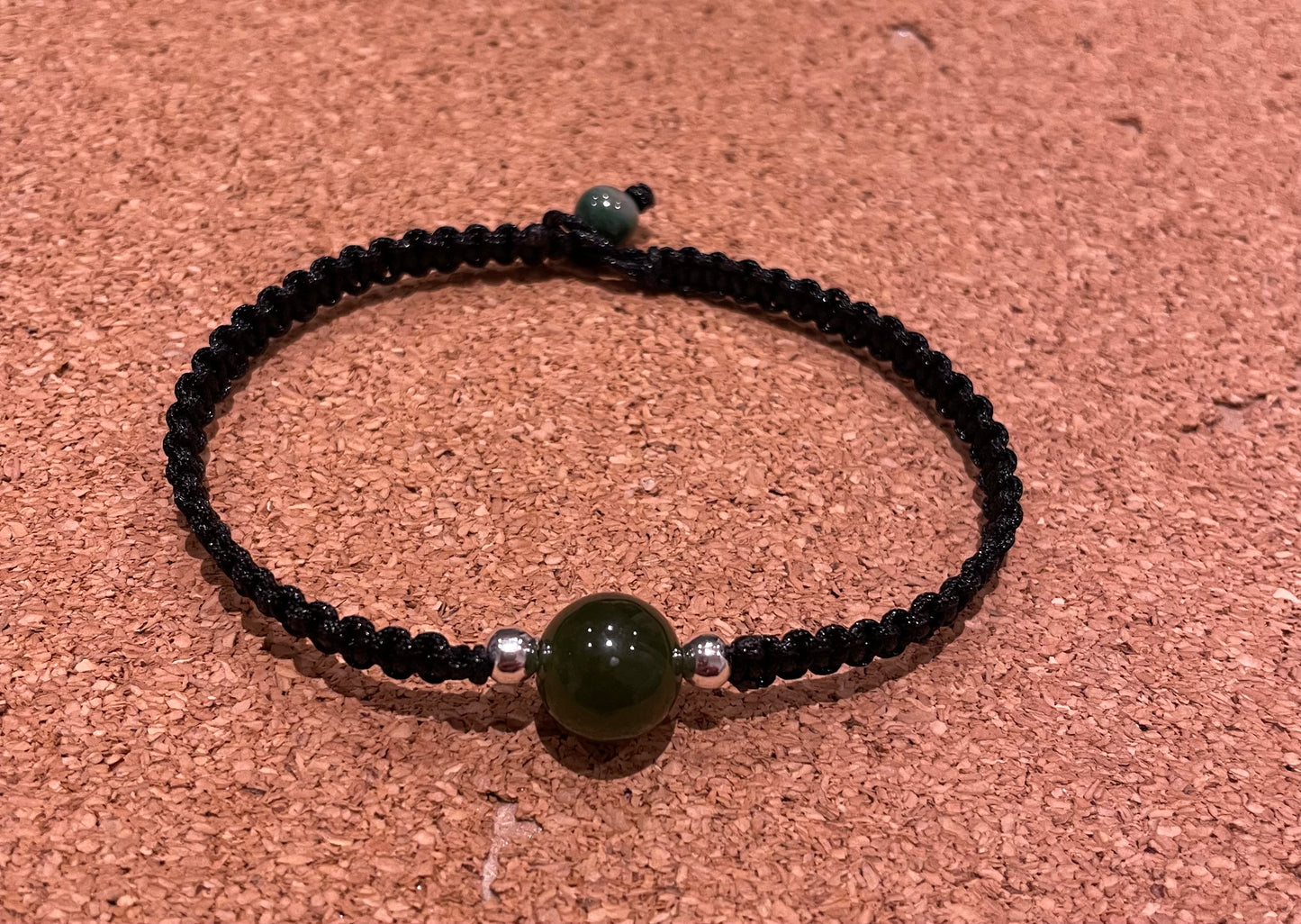 Handmade bracelet with a green jade bead charm