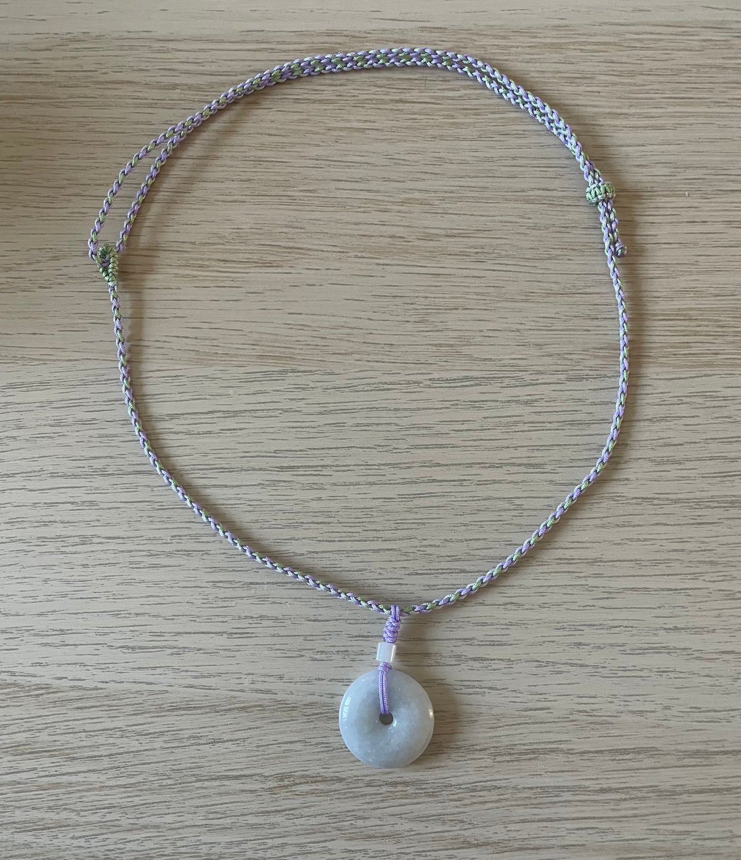 Handmade necklace with a light purple jade donut