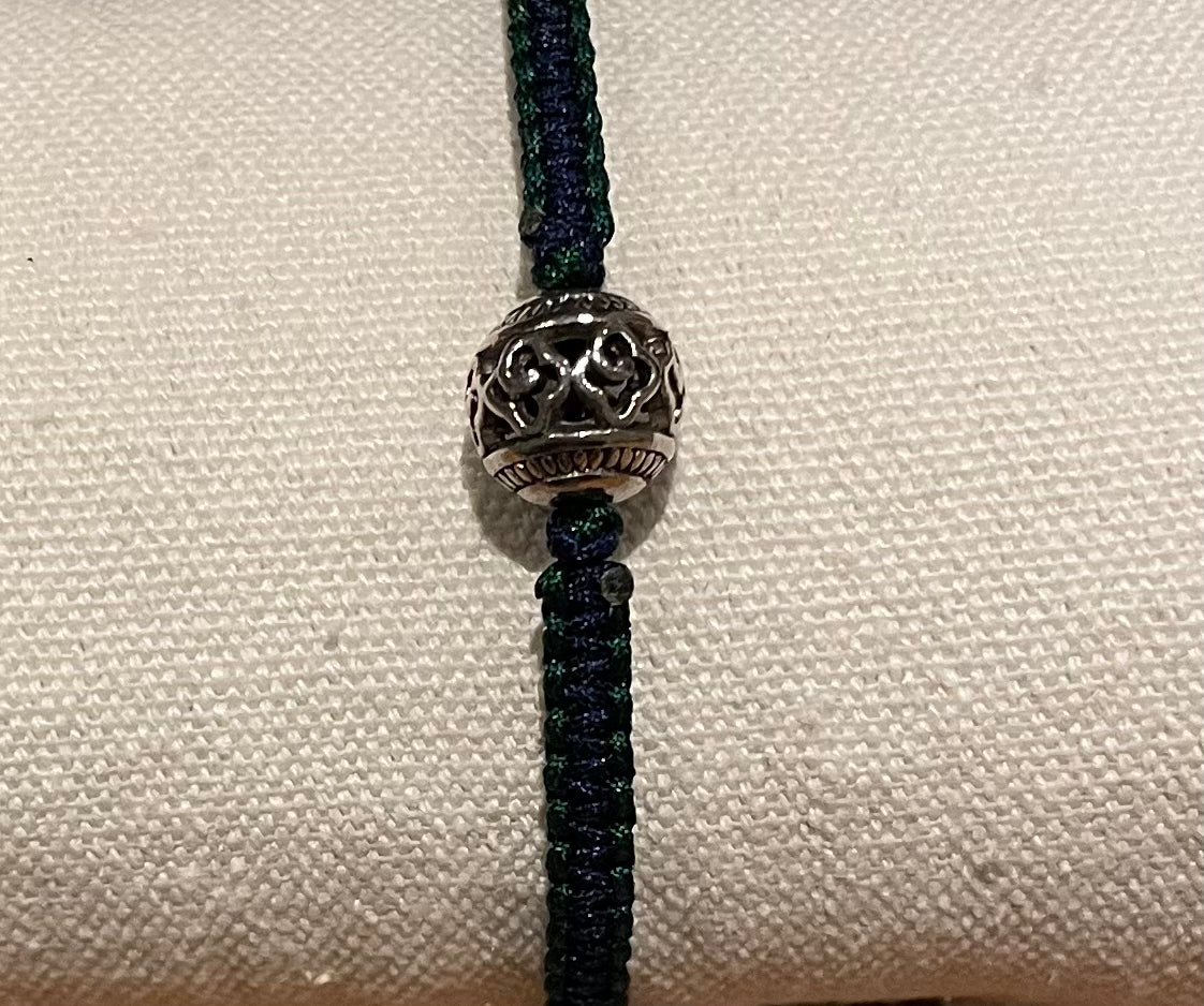 Handmade bracelet with a silver alloy bead charm