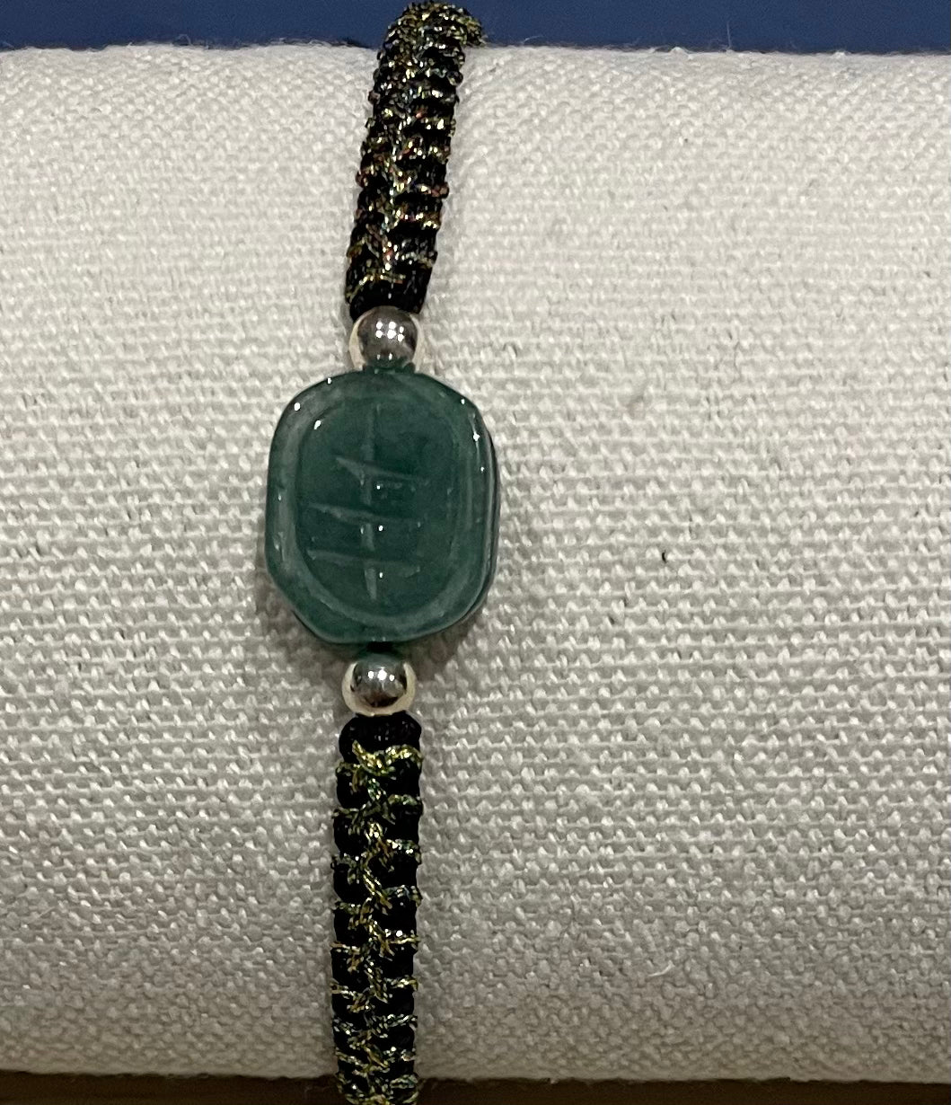 Handmade bracelet with a green jade charm