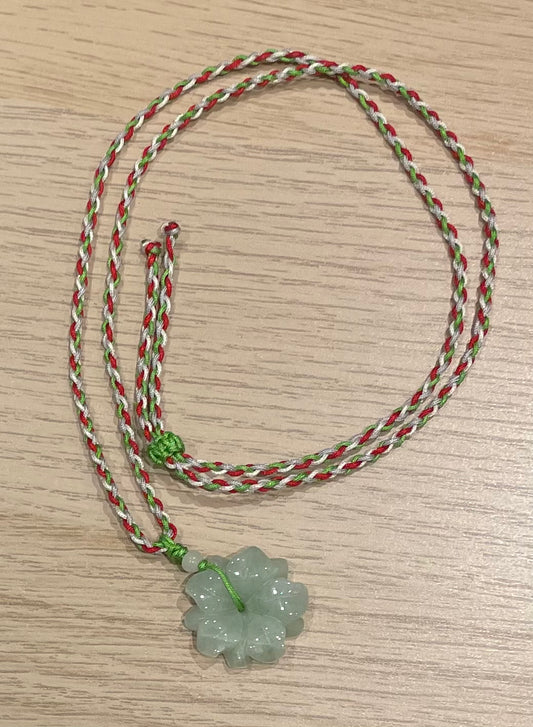 Handmade necklace with colourful  string and green jade pendant