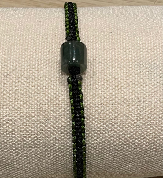 Handmade bracelet with a green jade charm